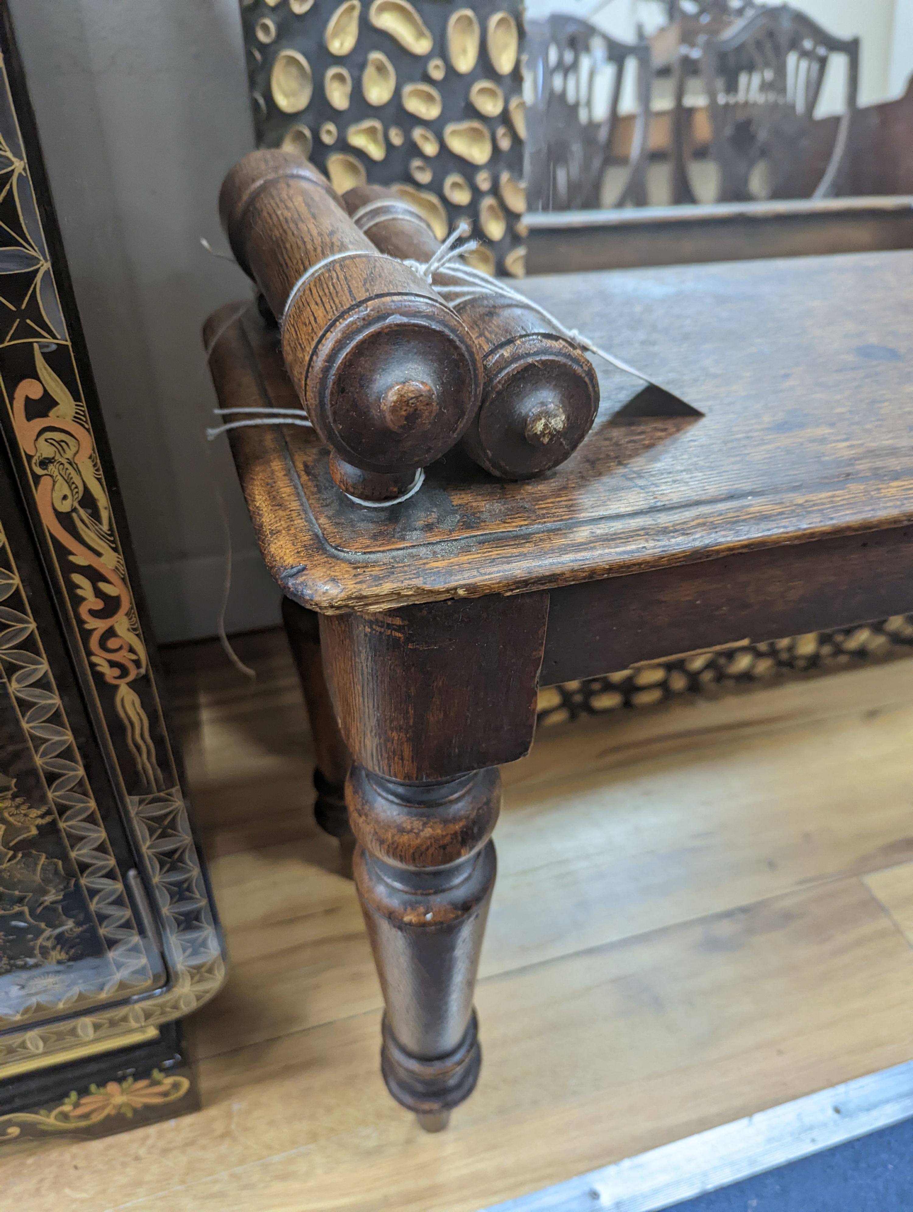 A Victorian oak window seat W-107cm, D-28cm, H-53cm, one handle bar detached but present